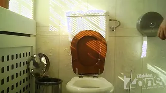 Blonde Pisses In A Public Toilet And Gets Caught On A Hidden Camera